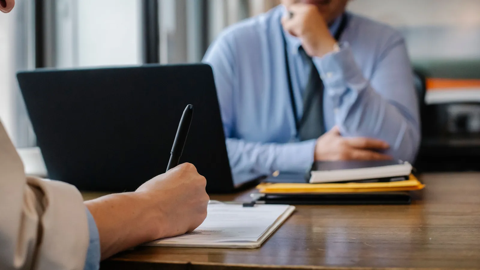 Employee reviewing paperwork during an employment meeting